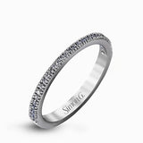 Featuring a contemporary take on a vintage style, this white gold engagement ring and band is complemented by .50 ctw of striking round cut white diamonds.