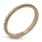 Featuring a contemporary take on a vintage style, this white gold engagement ring and band is complemented by .50 ctw of striking round cut white diamonds.