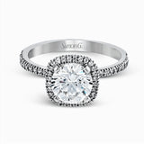 Featuring a contemporary take on a vintage style, this white gold engagement ring and band is complemented by .50 ctw of striking round cut white diamonds.