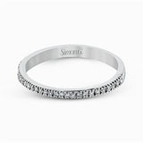 Featuring a contemporary take on a vintage style, this white gold engagement ring and band is complemented by .50 ctw of striking round cut white diamonds.