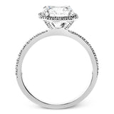 Featuring a contemporary take on a vintage style, this white gold engagement ring and band is complemented by .50 ctw of striking round cut white diamonds.