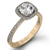 Accented by .46 ctw of glistening round cut white diamonds, this contemporary white gold halo style engagement ring and wedding band set makes a dramatic statement.