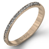 Accented by .46 ctw of glistening round cut white diamonds, this contemporary white gold halo style engagement ring and wedding band set makes a dramatic statement.