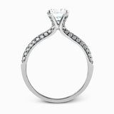 The classic design of this white gold engagement ring and wedding band set is emphasized by .72 ctw round cut white diamonds.