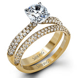 The classic design of this white gold engagement ring and wedding band set is emphasized by .72 ctw round cut white diamonds.