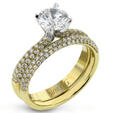The classic design of this white gold engagement ring and wedding band set is emphasized by .72 ctw round cut white diamonds.
