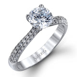 The classic design of this white gold engagement ring and wedding band set is emphasized by .72 ctw round cut white diamonds.