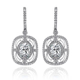 Featuring delicate vintage-inspired styling, these beautiful earrings are set with 1.00 ctw of round cut white diamonds and 2.21 ctw of lovely aquamarines.