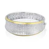 Offering a distinctive contemporary style, this bangle bracelet is white and rose gold is accented by an astounding 18.85 ctw princess cut white diamonds and .79 round pink diamonds.