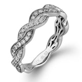 Featuring a dynamic two-tone twist design, this yellow and white gold contemporary ring is set with .53 ctw of round cut white diamonds.