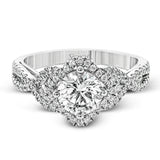 Set with .35 ctw of arresting round cut white diamonds, this lovely white gold engagement ring features a memorable intertwined design on the band.