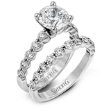 This marvelous white gold wedding set highlights its center stone with 1.19 ctw of round white diamond accents.