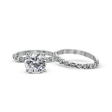 This marvelous white gold wedding set highlights its center stone with 1.19 ctw of round white diamond accents.