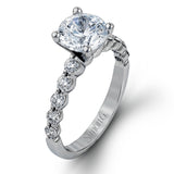 This marvelous white gold wedding set highlights its center stone with 1.19 ctw of round white diamond accents.