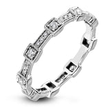 This white gold band form a modern style band set with .33 ctw of striking round cut white diamond accents. Perfect for stacking.