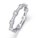 This white gold band form a modern style band set with .33 ctw of striking round cut white diamond accents. Perfect for stacking.