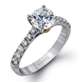 This charming contemporary two-tone wedding set is accented by .66 ctw of glistening round cut white diamonds with .02 ctw round cut yellow diamond accents.
