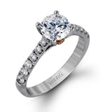 This charming contemporary two-tone wedding set is accented by .66 ctw of glistening round cut white diamonds with .02 ctw round cut yellow diamond accents.