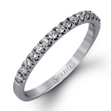 This charming contemporary two-tone wedding set is accented by .66 ctw of glistening round cut white diamonds with .02 ctw round cut yellow diamond accents.