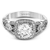 This impressive white gold engagement ring is accented by .23 ctw white round cut diamonds and .20 ctw marquise cut diamonds.