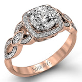This impressive white gold engagement ring is accented by .23 ctw white round cut diamonds and .20 ctw marquise cut diamonds.