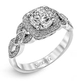 This impressive white gold engagement ring is accented by .23 ctw white round cut diamonds and .20 ctw marquise cut diamonds.
