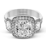 Featuring an impressive modern design, this white gold ring features .53 ctw emerald cut stone sides and .46 ctw round cut white diamonds.