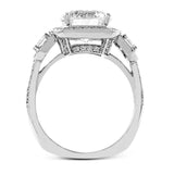 Featuring an impressive modern design, this white gold ring features .53 ctw emerald cut stone sides and .46 ctw round cut white diamonds.