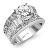Dramatic and bold, this white gold contemporary engagement ring is accented by 1.87 ctw princess cut white diamonds and 1.67 ctw glistening baguette white diamonds.