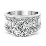 Dramatic and bold, this white gold contemporary engagement ring is accented by 1.87 ctw princess cut white diamonds and 1.67 ctw glistening baguette white diamonds.