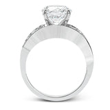 Dramatic and bold, this white gold contemporary engagement ring is accented by 1.87 ctw princess cut white diamonds and 1.67 ctw glistening baguette white diamonds.