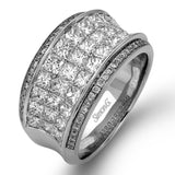 This contemporary two-tone band is set with a triple row of 2.45 ctw princess cut white diamonds silhouetted by .19 ctw round yellow diamond accents.