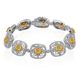 This dazzling vintage-inspired yellow, rose, and white gold bracelet is accented by 3.38 ctw round cut white diamonds and 2.80 ctw yellow oval diamonds.