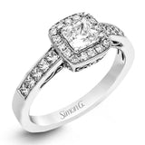 This lovely contemporary white gold engagement ring is set with .34 ctw of glistening princess cut white diamonds and .13 ctw of round cut white diamonds.