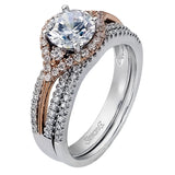 Featuring a modern design, this rose and white gold engagement ring and wedding band is highlighted by .51 ctw of round cut white diamonds.