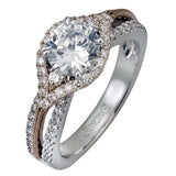 Featuring a modern design, this rose and white gold engagement ring and wedding band is highlighted by .51 ctw of round cut white diamonds.