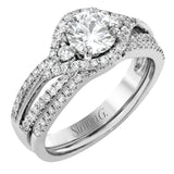 Featuring a modern design, this rose and white gold engagement ring and wedding band is highlighted by .51 ctw of round cut white diamonds.