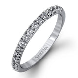 The classic halo design of this white gold engagement ring and wedding band are elevated by .80 ctw of shimmering round cut white diamonds.