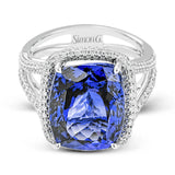 This classic 18k white gold ring features an extraordinary 14.25 ct tanzanite center stone which is accented by .89 ctw of white diamonds.