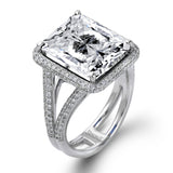 This classic 18k white gold ring features an extraordinary 14.25 ct tanzanite center stone which is accented by .89 ctw of white diamonds.