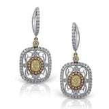 Featuring delicate vintage-inspired styling, these three-tone dangle earrings are set with .70 ctw round cut white diamonds and .50 ctw yellow oval diamonds.