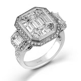 This impressive white and rose gold ring is set with a 3.0 ctw mosaic of white diamonds accented by .45 ctw round cut white diamonds, 1.06 emerald cut white diamonds, and .30 pink diamonds.