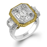 This impressive white and rose gold ring is set with a 3.0 ctw mosaic of white diamonds accented by .45 ctw round cut white diamonds, 1.06 emerald cut white diamonds, and .30 pink diamonds.