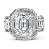 This impressive white and rose gold ring is set with a 3.0 ctw mosaic of white diamonds accented by .45 ctw round cut white diamonds, 1.06 emerald cut white diamonds, and .30 pink diamonds.