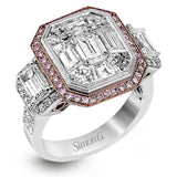 This impressive white and rose gold ring is set with a 3.0 ctw mosaic of white diamonds accented by .45 ctw round cut white diamonds, 1.06 emerald cut white diamonds, and .30 pink diamonds.