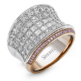This dramatic white and rose gold ring features a stunning 4.38 ctw of princess cut white diamonds and .20 ctw of round cut pink diamonds in a gorgeous setting.