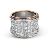 This dramatic white and rose gold ring features a stunning 4.38 ctw of princess cut white diamonds and .20 ctw of round cut pink diamonds in a gorgeous setting.