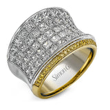 This dramatic white and rose gold ring features a stunning 4.38 ctw of princess cut white diamonds and .20 ctw of round cut pink diamonds in a gorgeous setting.