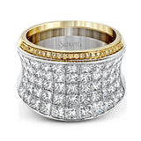 This dramatic white and rose gold ring features a stunning 4.38 ctw of princess cut white diamonds and .20 ctw of round cut pink diamonds in a gorgeous setting.