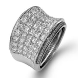 This dramatic white and rose gold ring features a stunning 4.38 ctw of princess cut white diamonds and .20 ctw of round cut pink diamonds in a gorgeous setting.